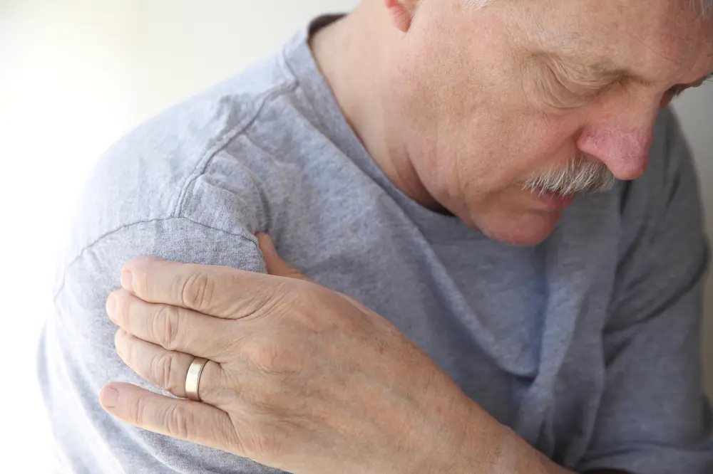 Older man with rotator cuff injury