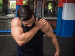 Man in the gym with injured shoulder.