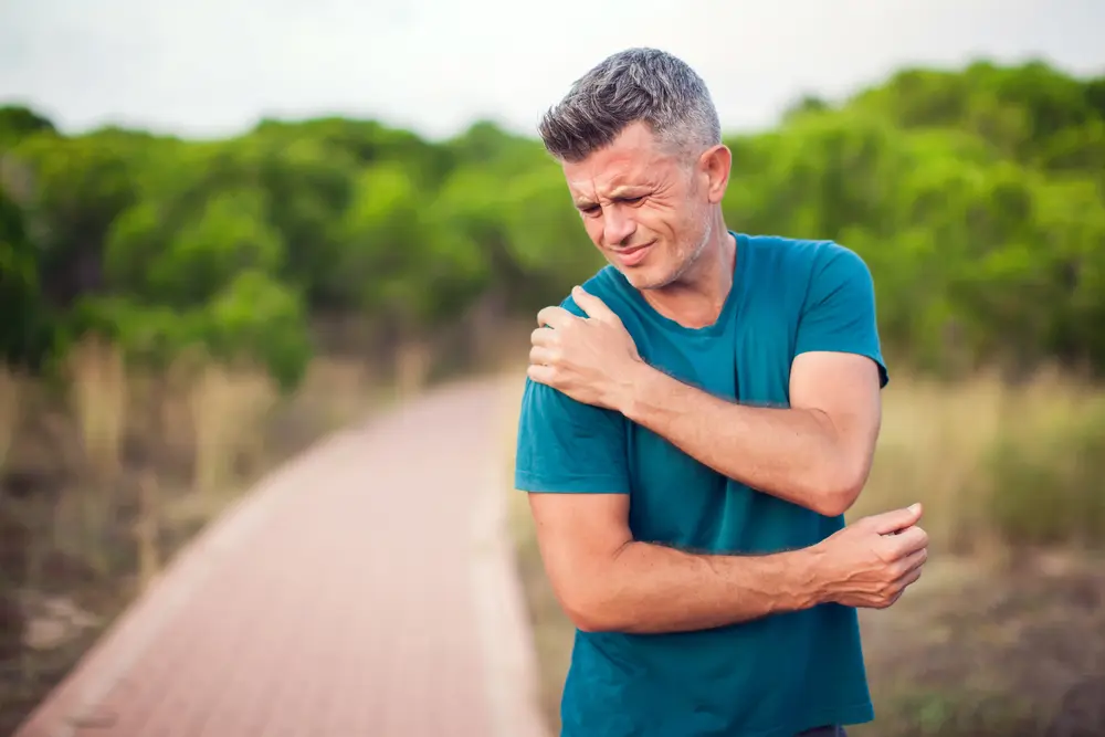 Man with arthritis pain in shoulder.