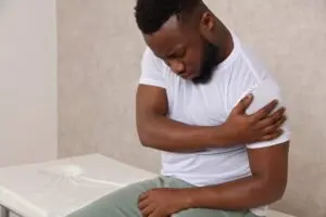 Man suffering from shoulder bursitis. 