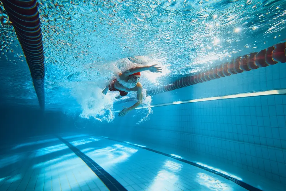 woman swimming.